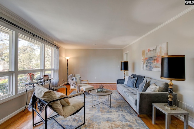 living room featuring hardwood / wood-style flooring and ornamental molding