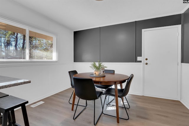 dining room with light wood-type flooring