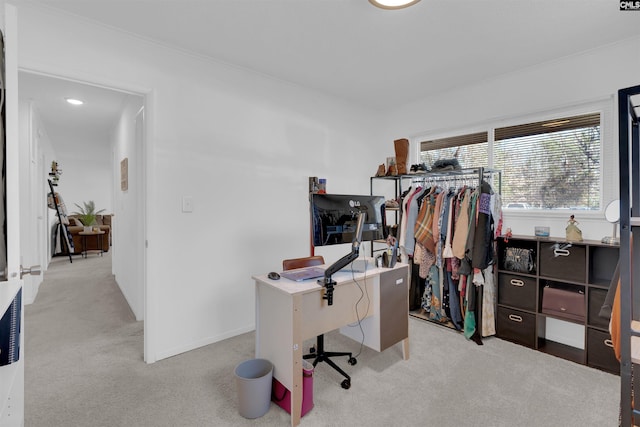 office area featuring ornamental molding and light carpet