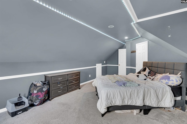 bedroom featuring vaulted ceiling and light colored carpet