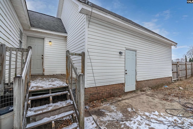 view of snow covered property entrance