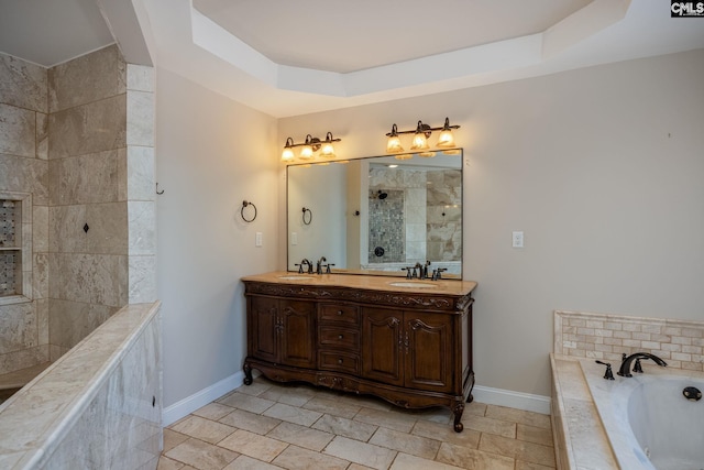 bathroom featuring vanity, a tray ceiling, tile patterned flooring, and shower with separate bathtub