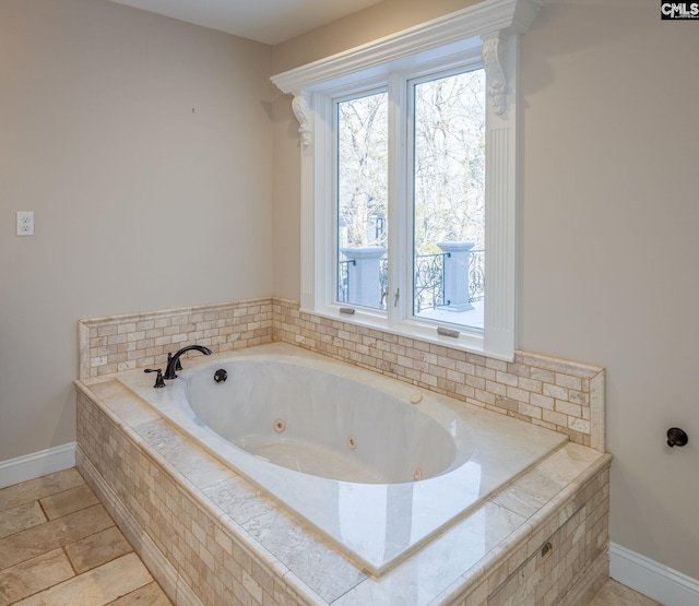 bathroom featuring tiled tub