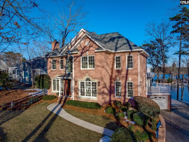 view of front of property with a garage and a front yard