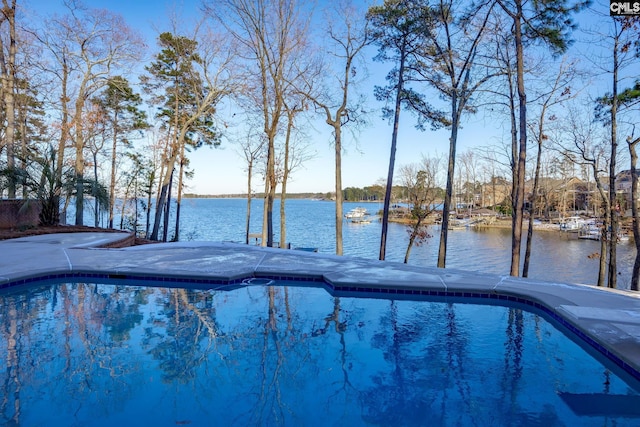 view of pool with a water view