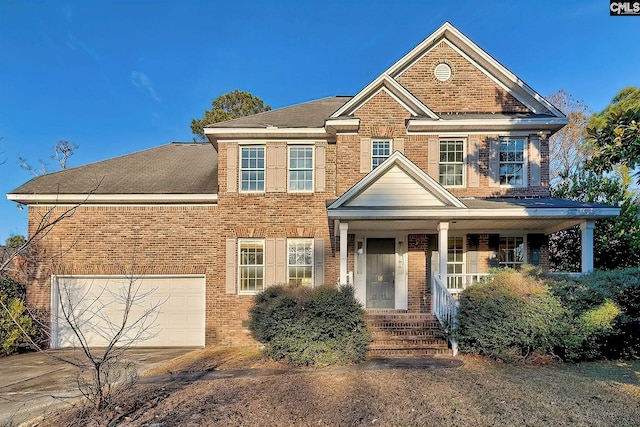 view of front facade featuring a garage and a porch