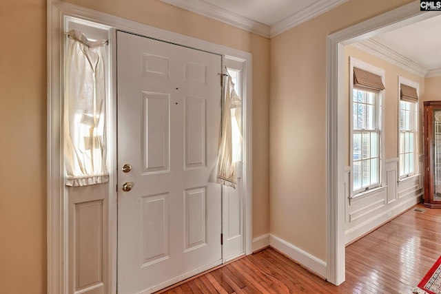 entrance foyer featuring light hardwood / wood-style flooring and ornamental molding