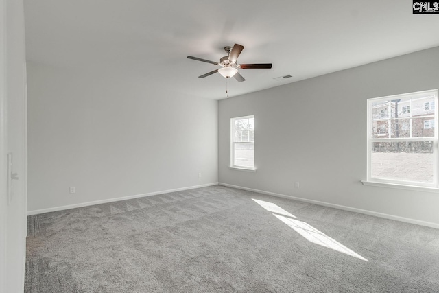 spare room with light carpet and ceiling fan