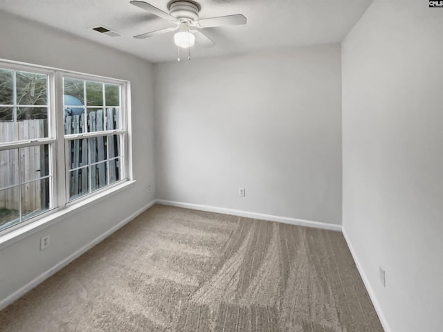 carpeted empty room with ceiling fan