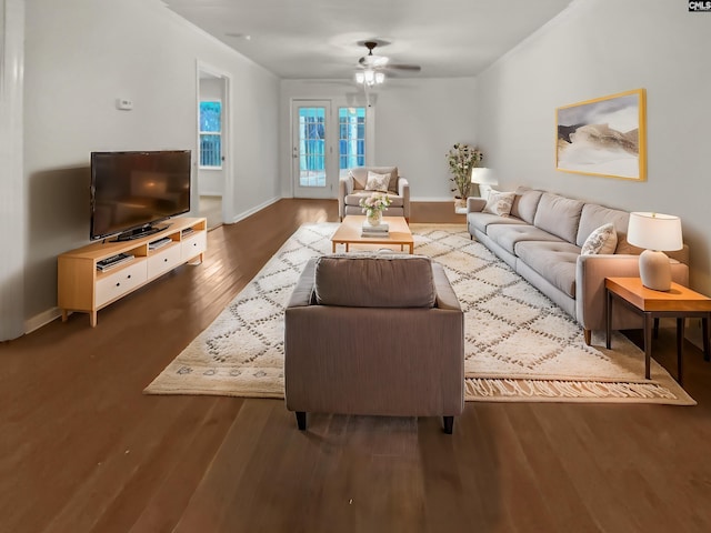 living room featuring hardwood / wood-style floors and ceiling fan