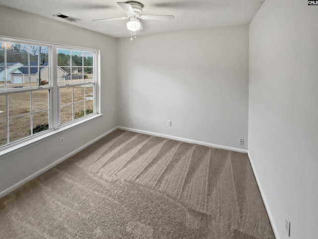 carpeted empty room with ceiling fan