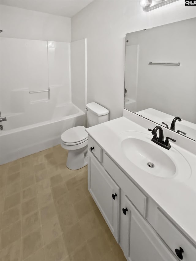 full bathroom with washtub / shower combination, vanity, and toilet