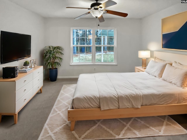 bedroom featuring light colored carpet and ceiling fan