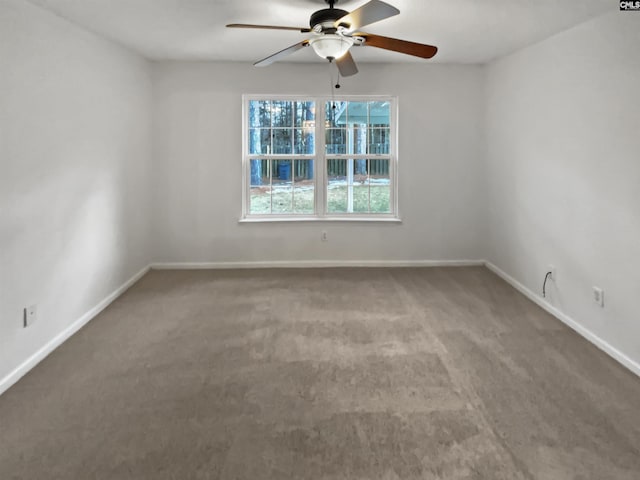 empty room featuring carpet flooring and ceiling fan