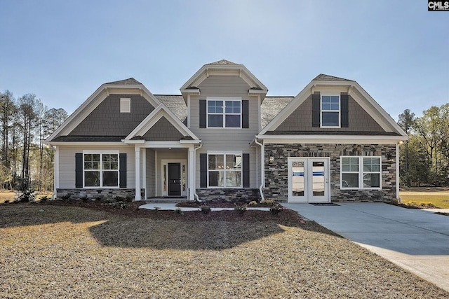 craftsman-style house featuring french doors