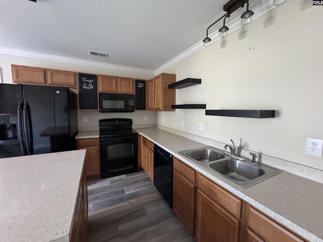 kitchen with sink, crown molding, black appliances, a textured ceiling, and dark hardwood / wood-style flooring