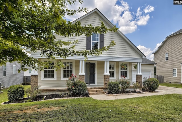 view of front of house with a garage, a front lawn, and a porch