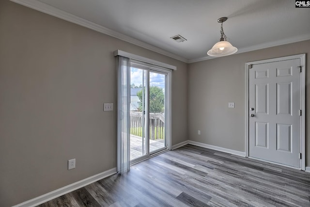 interior space featuring ornamental molding and wood-type flooring