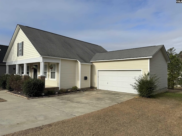 view of front facade with a garage and a porch