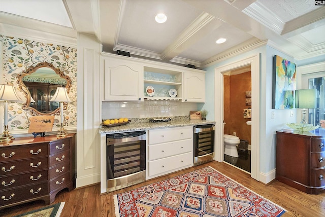 kitchen with white cabinetry, beverage cooler, dark hardwood / wood-style flooring, and beam ceiling