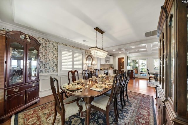 dining area with crown molding and dark hardwood / wood-style flooring