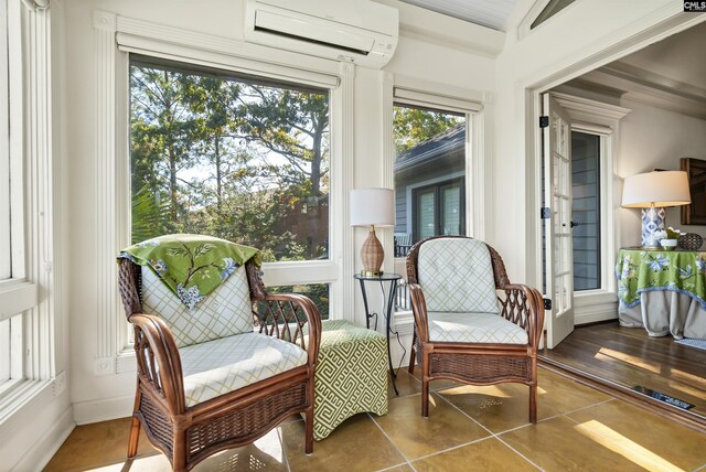 sunroom featuring a wall mounted AC