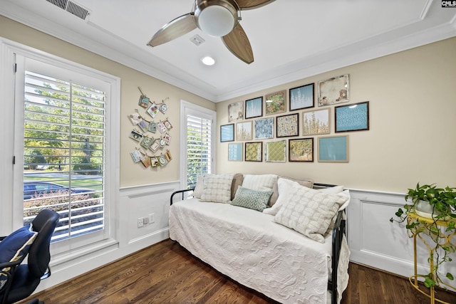 sitting room featuring ornamental molding, dark wood-type flooring, and ceiling fan