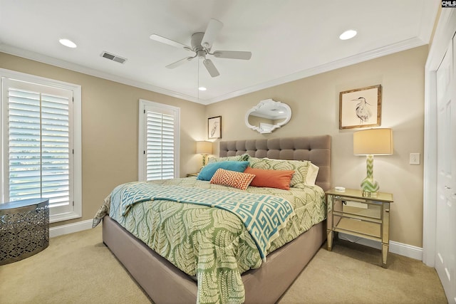 carpeted bedroom featuring multiple windows, a closet, and ceiling fan