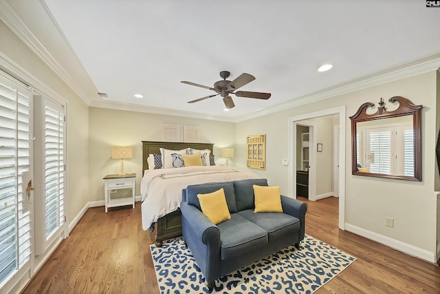 bedroom with crown molding, hardwood / wood-style flooring, multiple windows, and ceiling fan