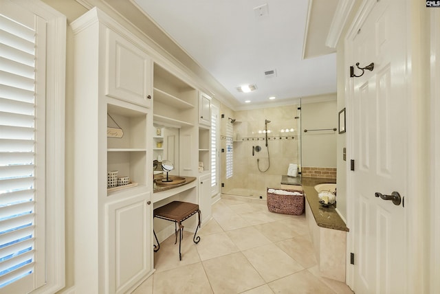 bathroom with independent shower and bath, ornamental molding, and tile patterned floors