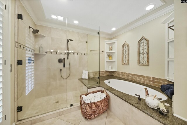 bathroom featuring crown molding, plus walk in shower, and tile patterned flooring