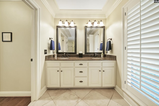 bathroom with vanity, ornamental molding, and tile patterned floors