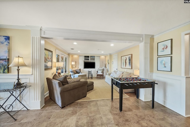 living room featuring crown molding and built in shelves