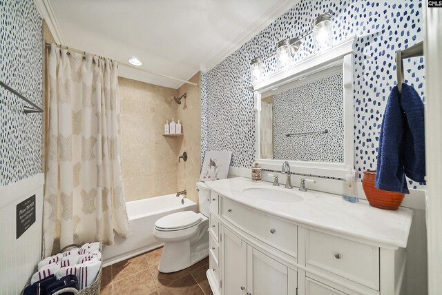 full bathroom featuring tile patterned floors, toilet, crown molding, vanity, and shower / bath combo with shower curtain