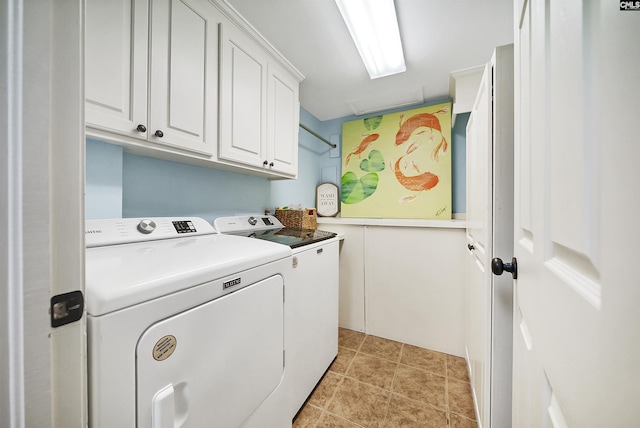 laundry area featuring cabinets, independent washer and dryer, and light tile patterned flooring