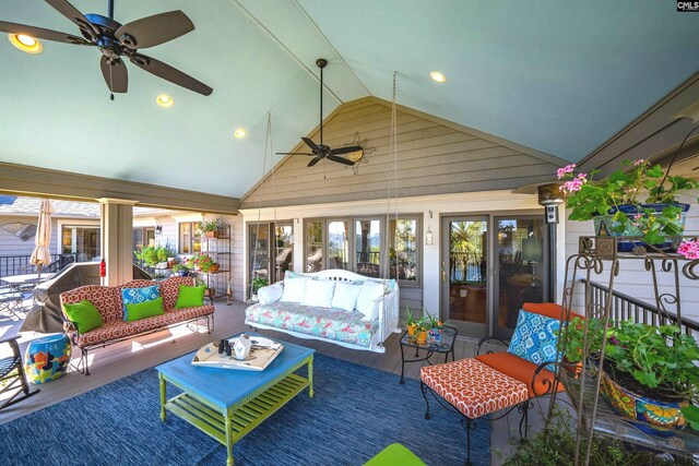 sunroom featuring vaulted ceiling, a wealth of natural light, and ceiling fan