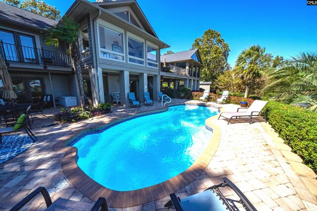 view of pool featuring a patio