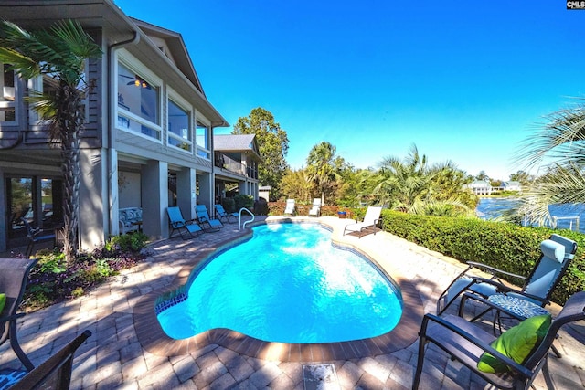 view of pool featuring a patio area