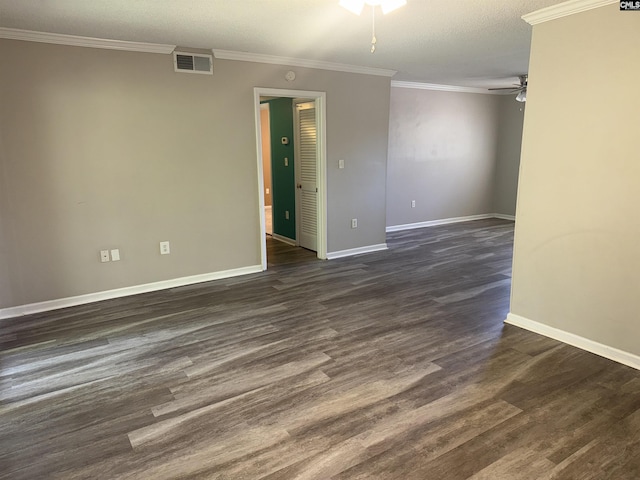 spare room with crown molding, dark wood-type flooring, a textured ceiling, and ceiling fan