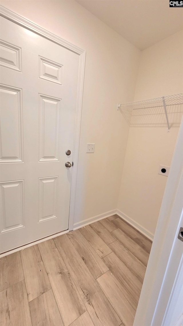 spacious closet with hardwood / wood-style floors