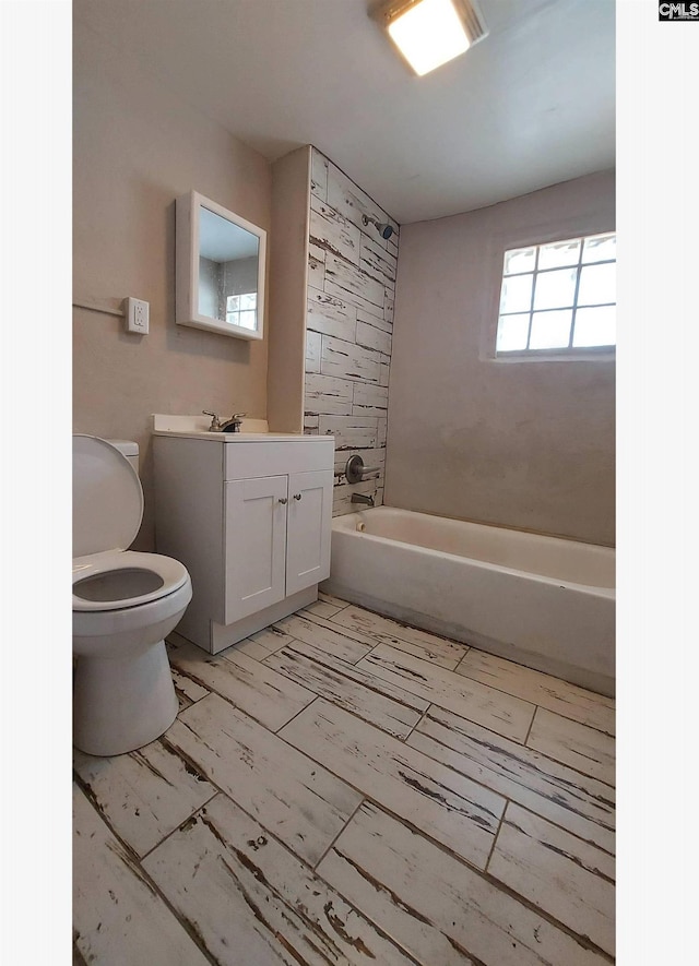 full bathroom with vanity, tub / shower combination, and toilet