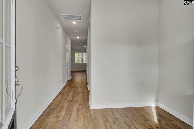 hall with light hardwood / wood-style flooring