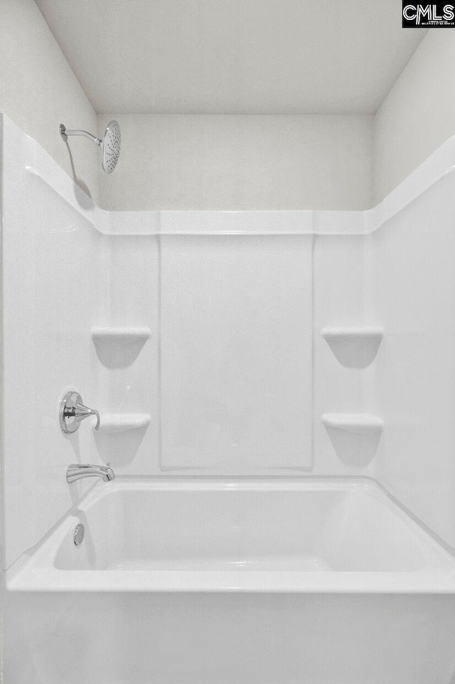 bathroom with shower / bath combination