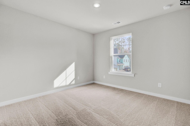 empty room featuring carpet flooring