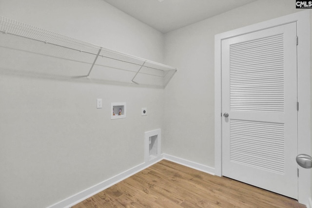 clothes washing area featuring washer hookup, hardwood / wood-style floors, and hookup for an electric dryer