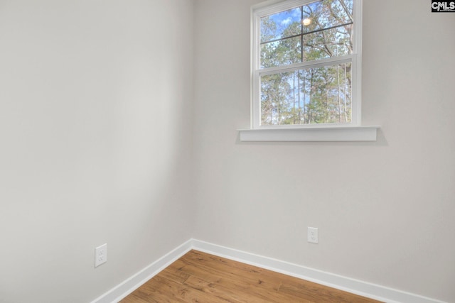 empty room with wood-type flooring