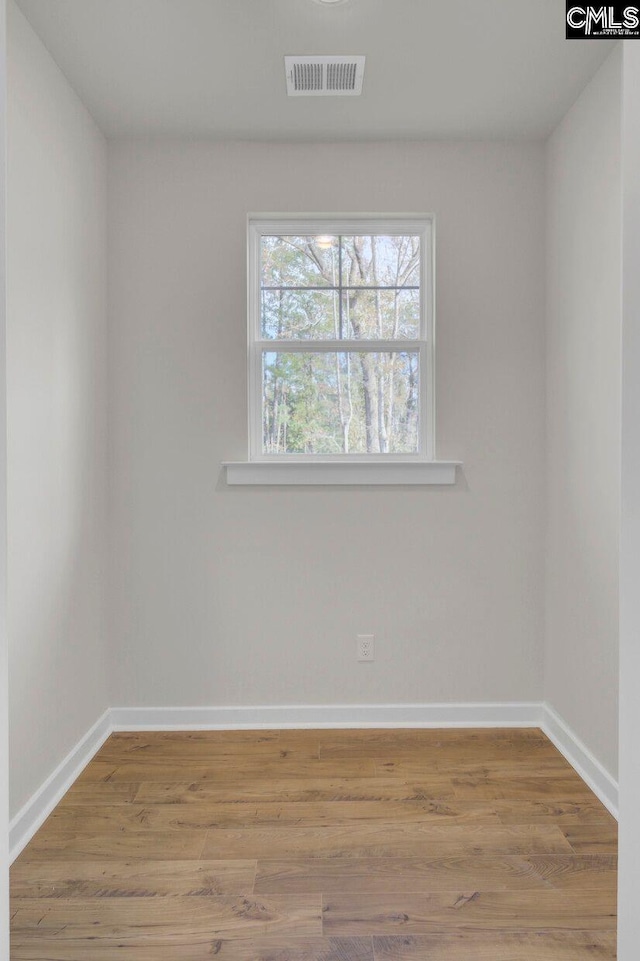 spare room featuring light hardwood / wood-style floors