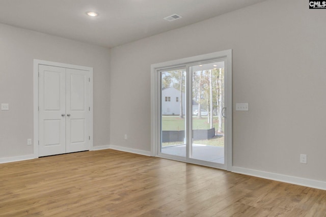 unfurnished room featuring light wood-type flooring