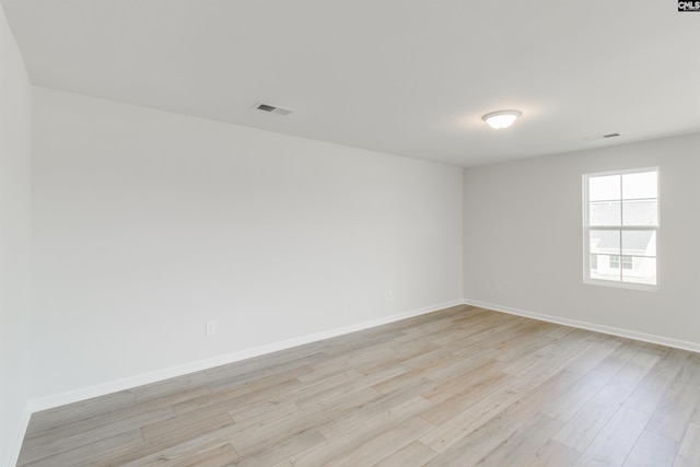 unfurnished room featuring light hardwood / wood-style floors