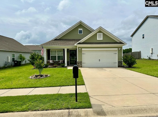 craftsman house with a garage and a front yard